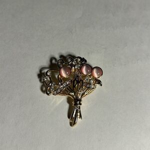 Faux gold with cubic zirconia & pink stones bouquet brooch.